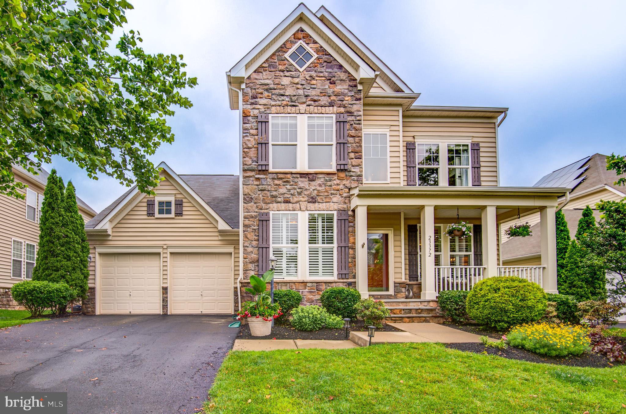23372 Minerva Drive Brambleton, VA 20148 - Photo 1 of 61 front view of a house with a yard