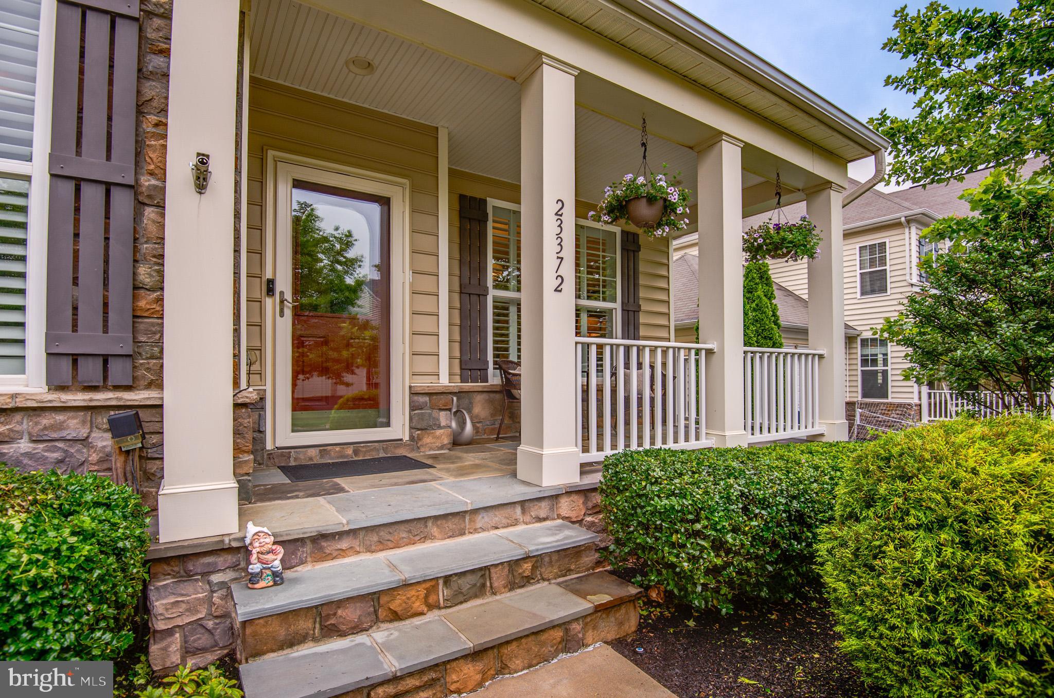 23372 Minerva Drive Brambleton, VA 20148 - Photo 2 of 61 front view of a house with a porch