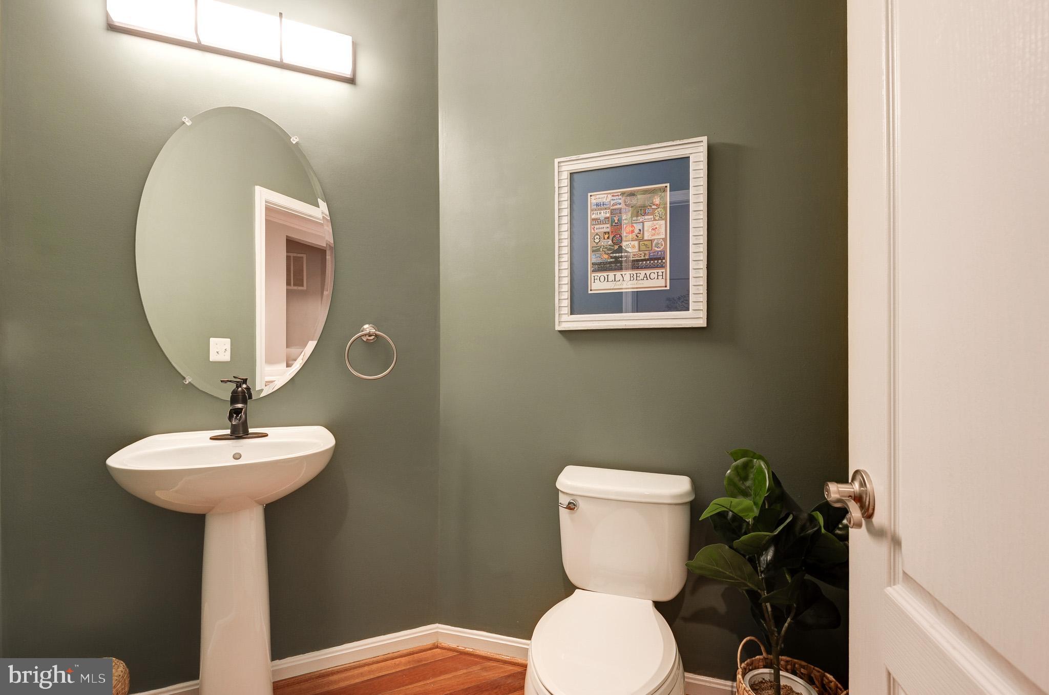 23372 Minerva Drive Brambleton, VA 20148 - Photo 23 of 61 a bathroom with a toilet sink and mirror