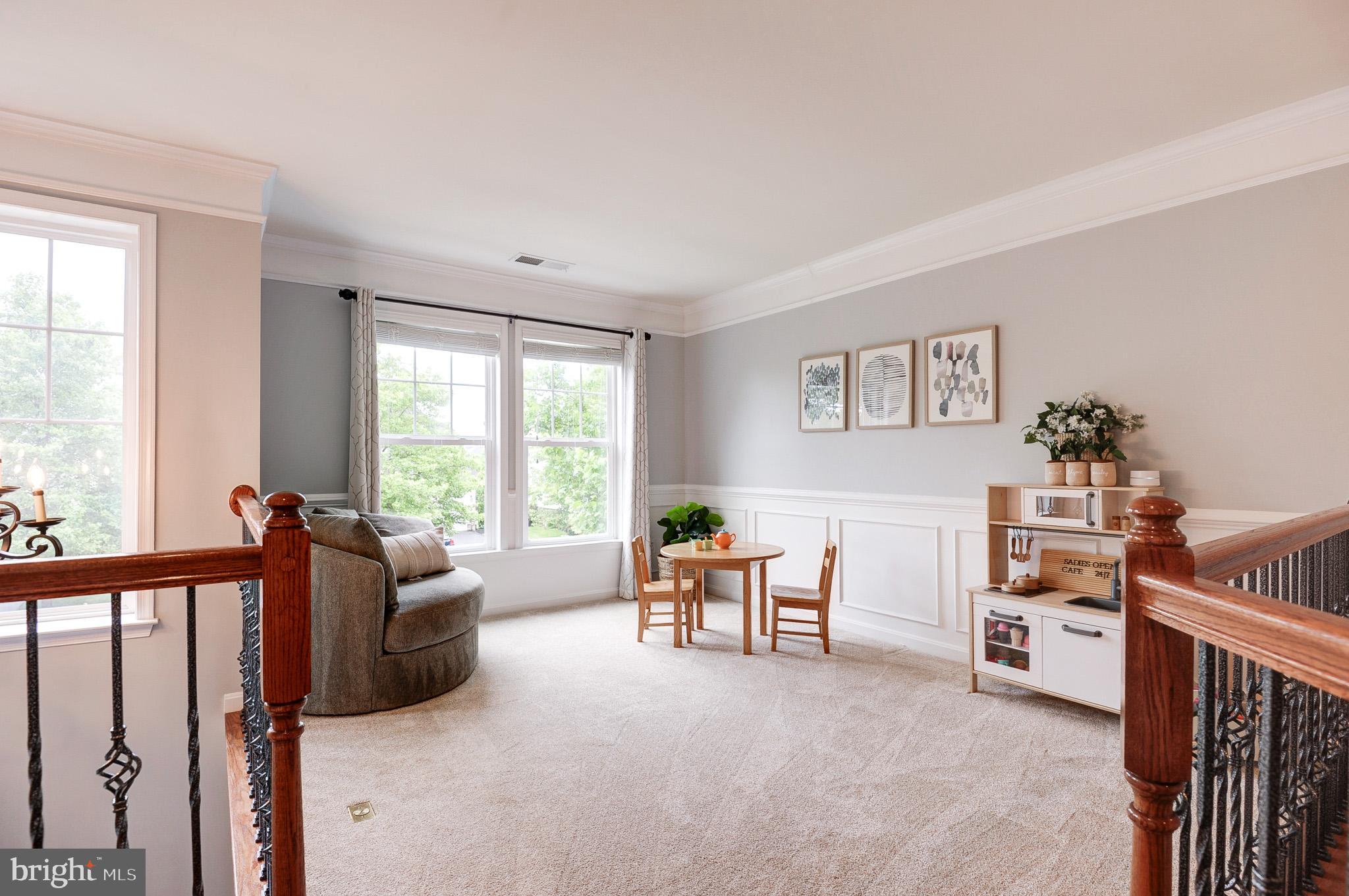 23372 Minerva Drive Brambleton, VA 20148 - Photo 25 of 61 a living room with furniture and a large window