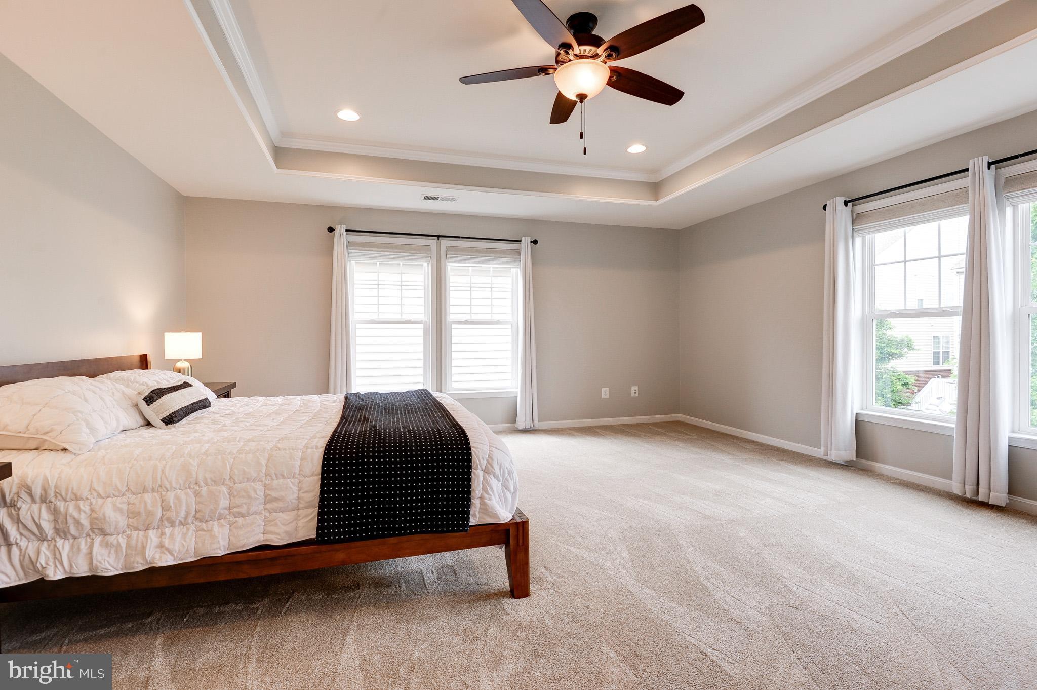 23372 Minerva Drive Brambleton, VA 20148 - Photo 29 of 61 a bedroom with a large bed and a window