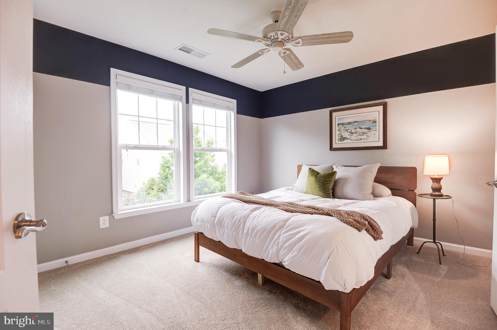 23372 Minerva Drive Brambleton, VA 20148 - Photo 41 of 61 a spacious bedroom with a bed and a window