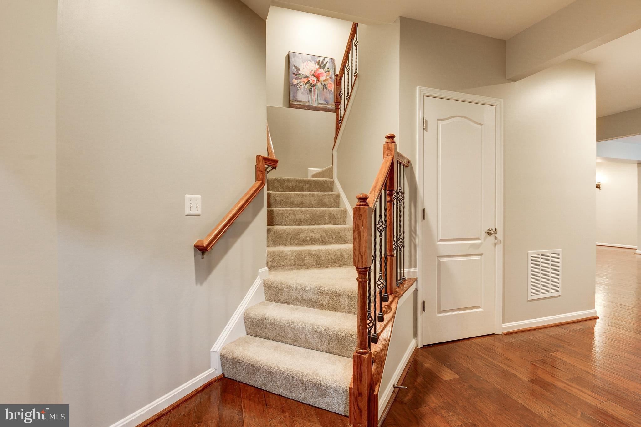 23372 Minerva Drive Brambleton, VA 20148 - Photo 43 of 61 a view of staircase with white walls and a window