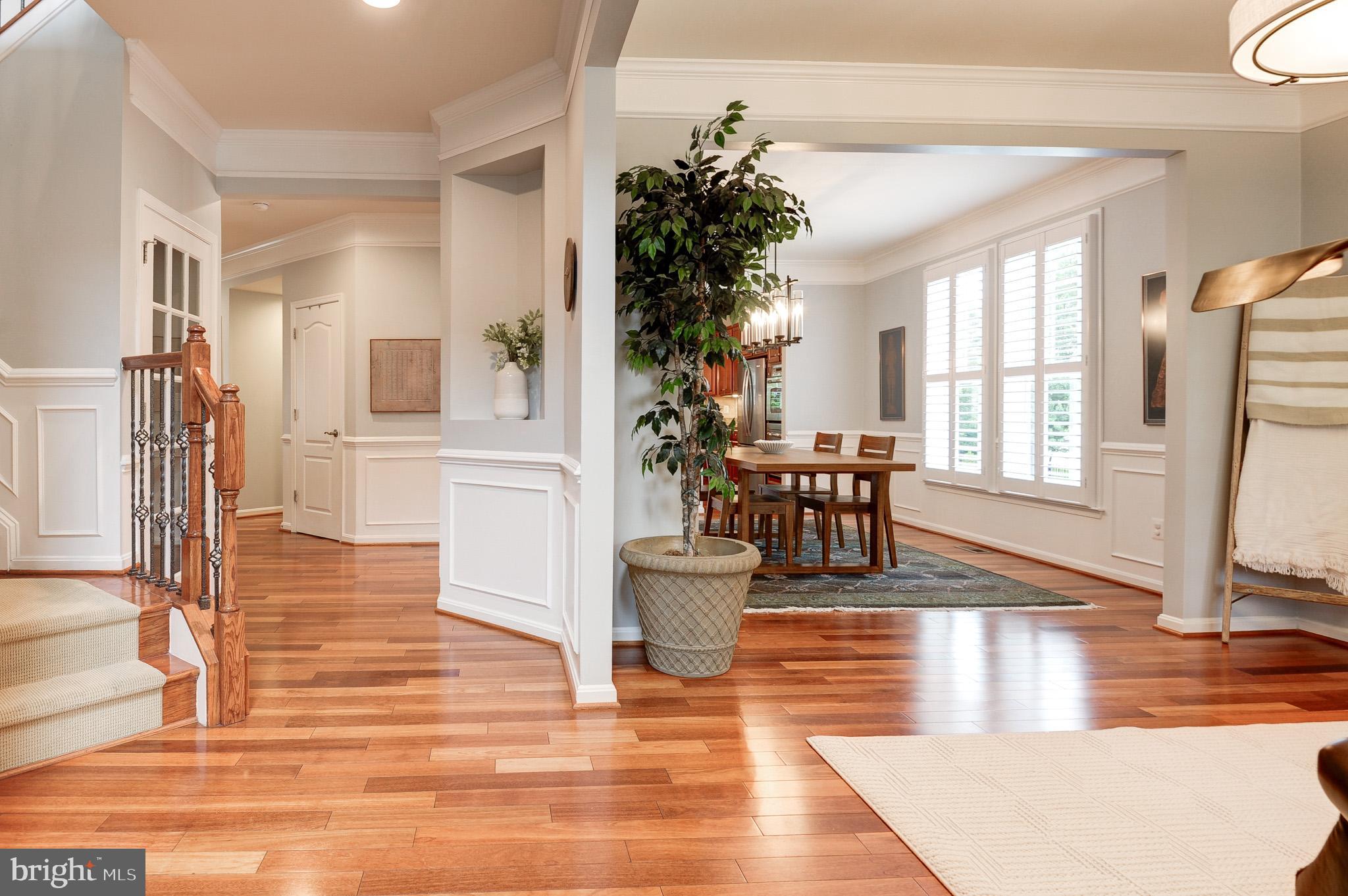 23372 Minerva Drive Brambleton, VA 20148 - Photo 5 of 61 a living room with furniture and a wooden floor