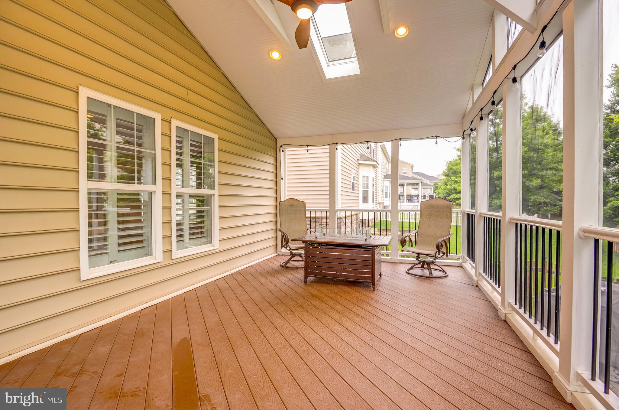 23372 Minerva Drive Brambleton, VA 20148 - Photo 55 of 61 a view of a patio with wooden floor and outdoor seating