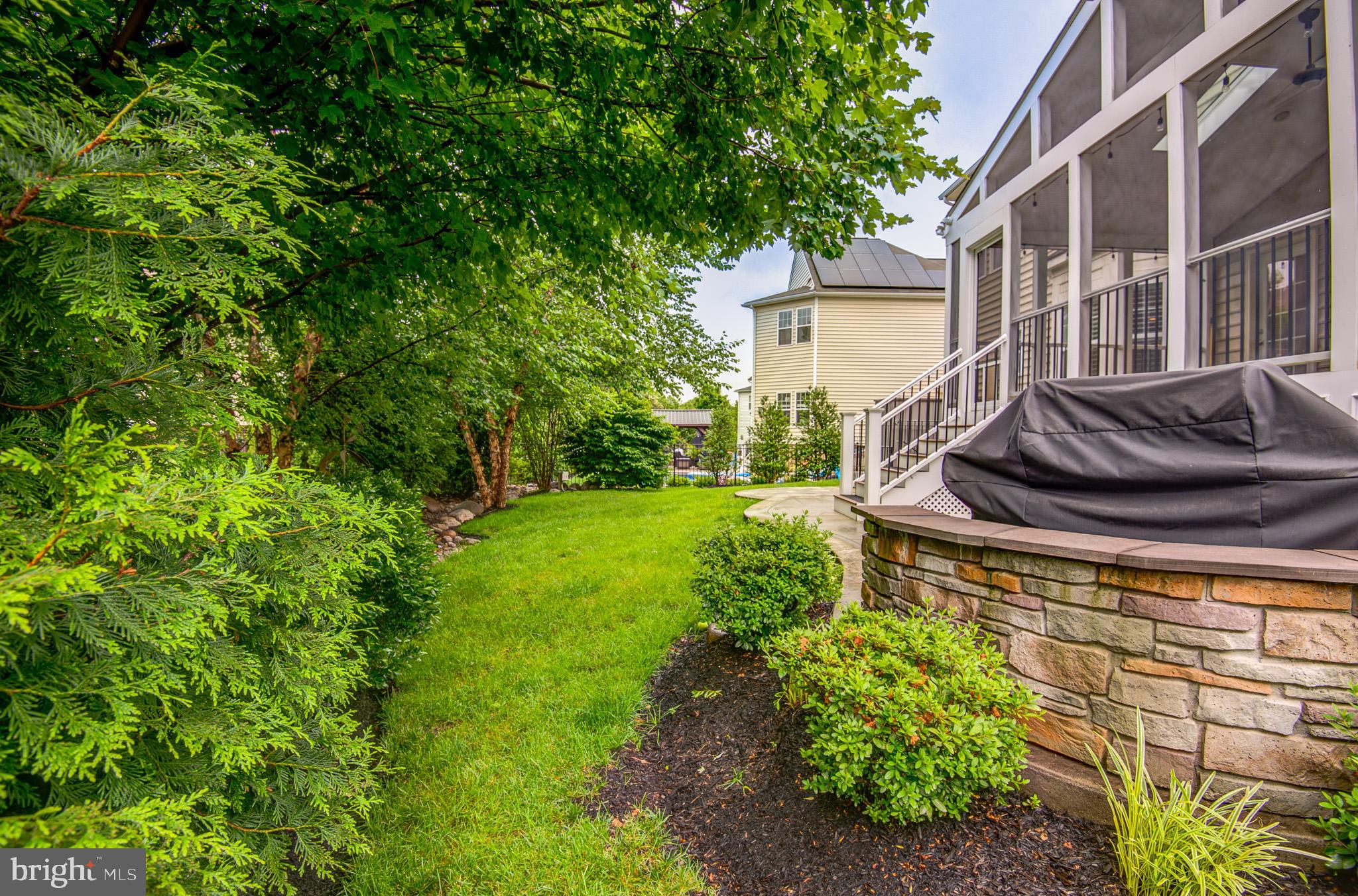 23372 Minerva Drive Brambleton, VA 20148 - Photo 57 of 61 a view of a house with backyard and sitting area