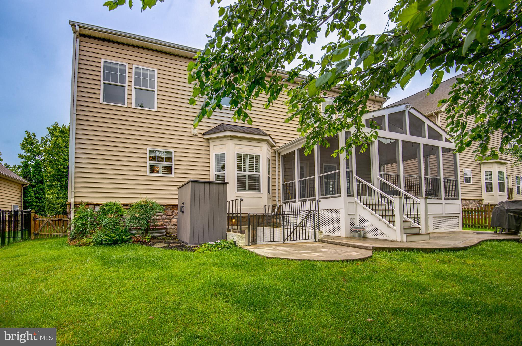 23372 Minerva Drive Brambleton, VA 20148 - Photo 59 of 61 a front view of house with yard and outdoor seating