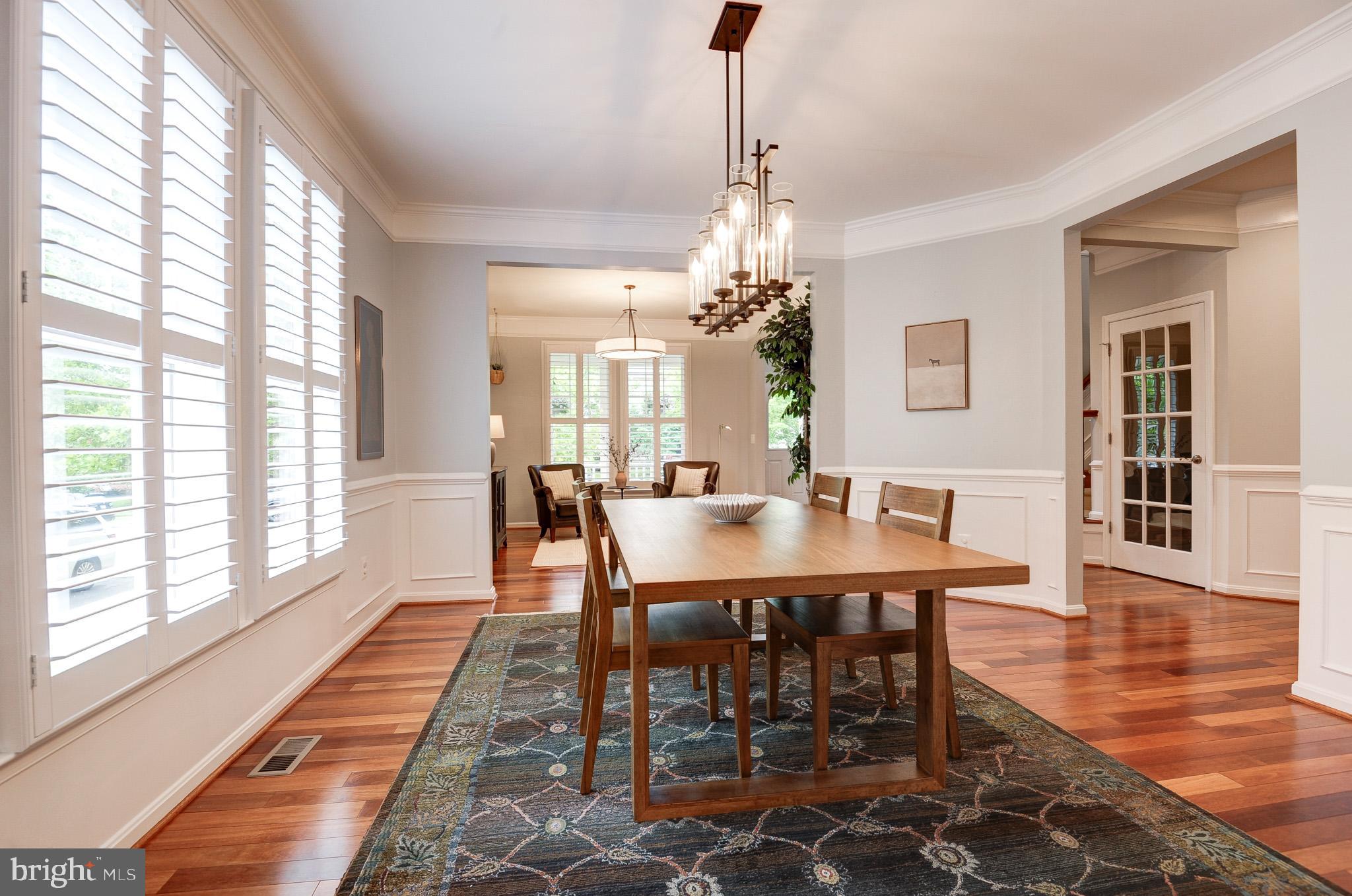 23372 Minerva Drive Brambleton, VA 20148 - Photo 9 of 61 a view of a dining room with furniture window and wooden floor