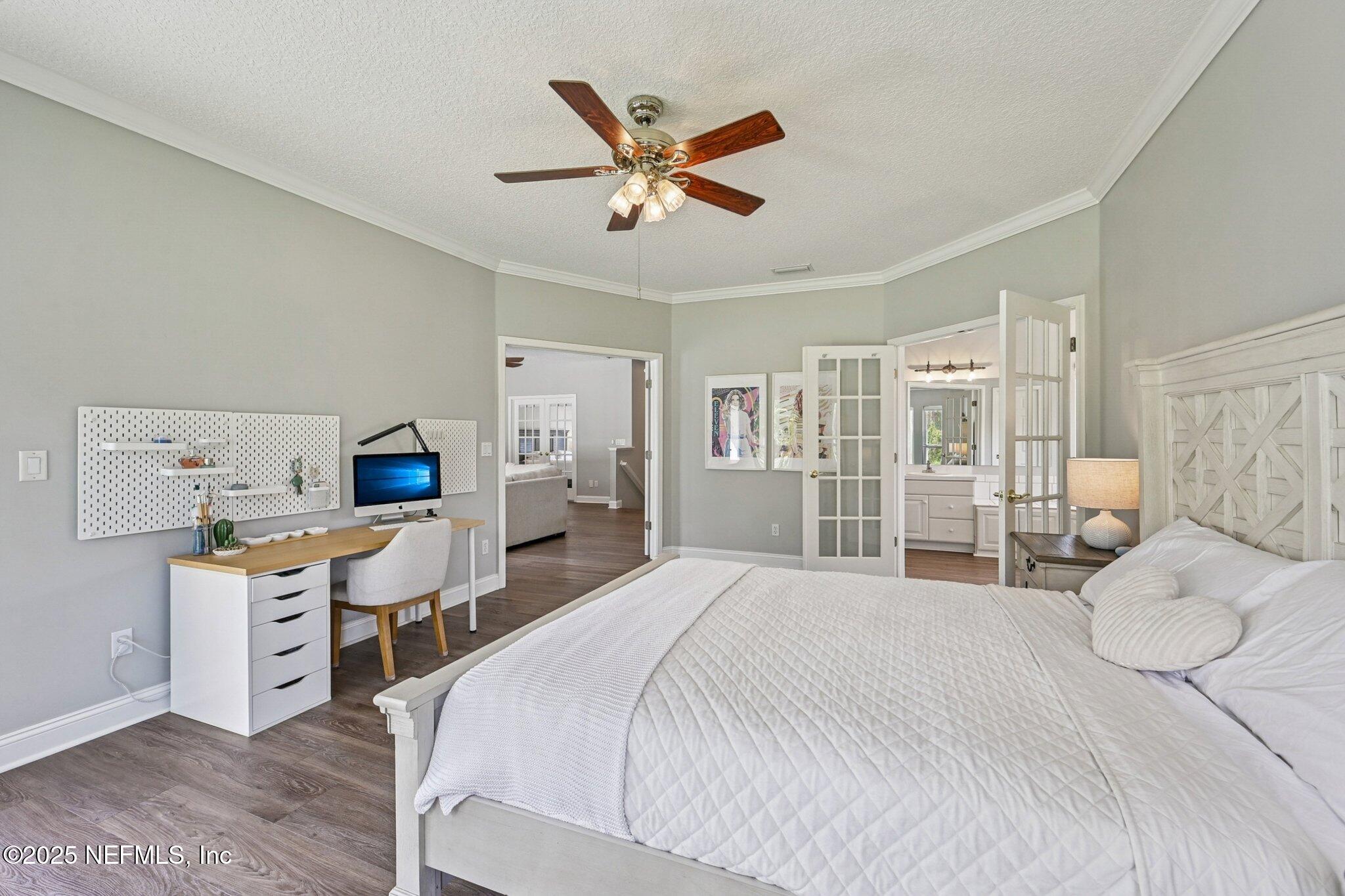 2300 Spring Hill Court Fleming Island, FL 32003 - Photo 19 of 45 a bedroom with a large bed and a desk