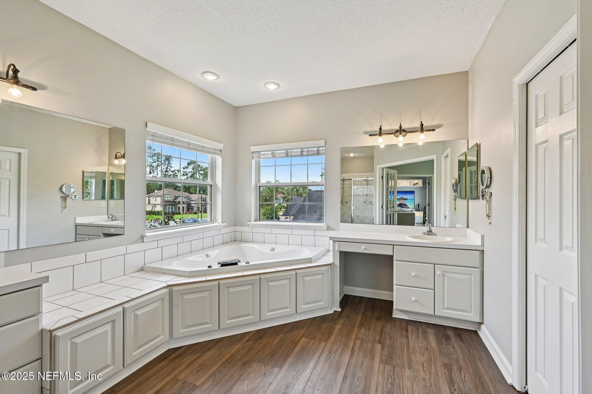 2300 Spring Hill Court Fleming Island, FL 32003 - Photo 20 of 45 a large white kitchen with a large window a sink and appliances