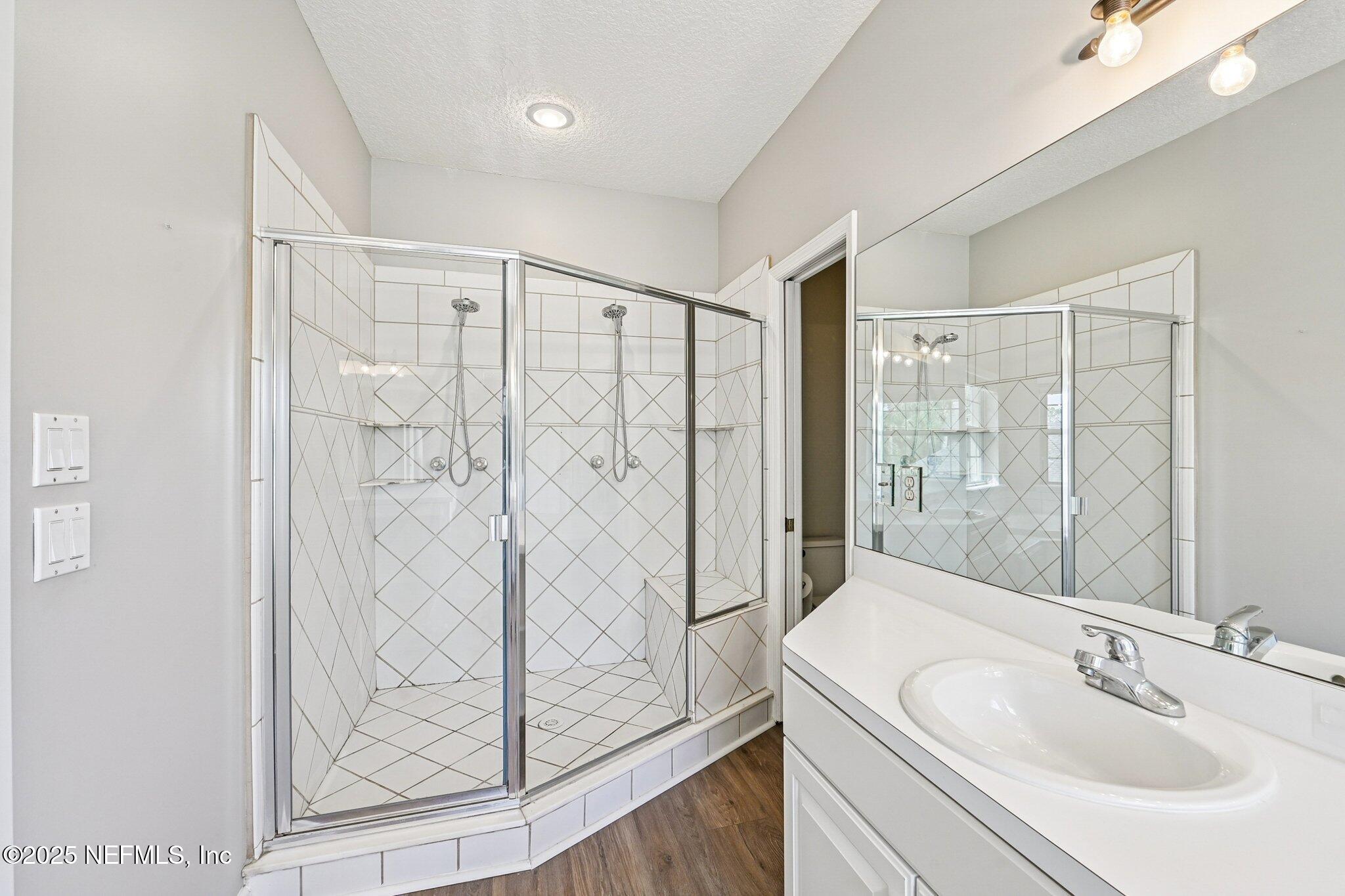 2300 Spring Hill Court Fleming Island, FL 32003 - Photo 21 of 45 a bathroom with a shower and a sink