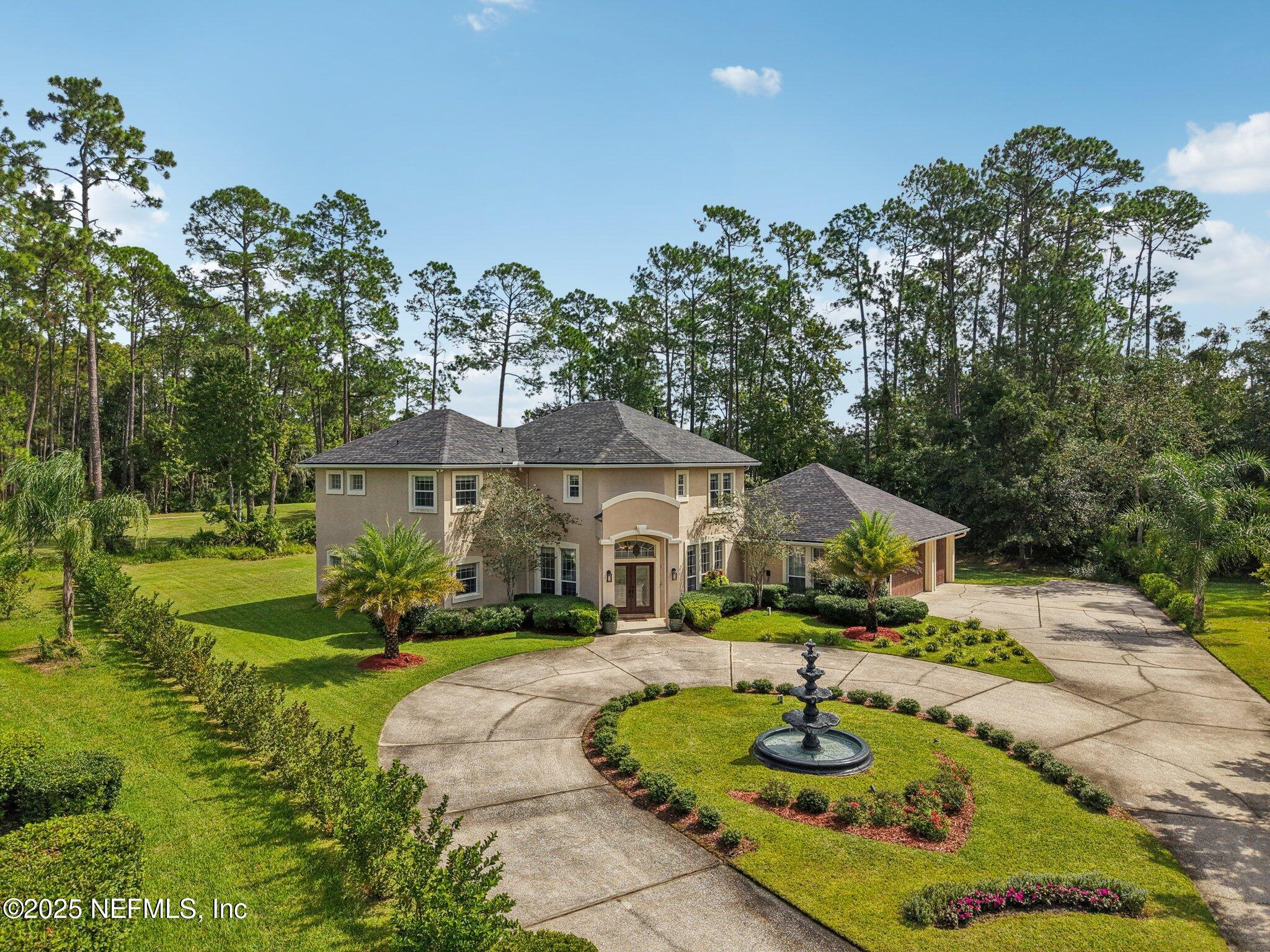 2300 Spring Hill Court Fleming Island, FL 32003 - Photo 34 of 45 a front view of a house with garden