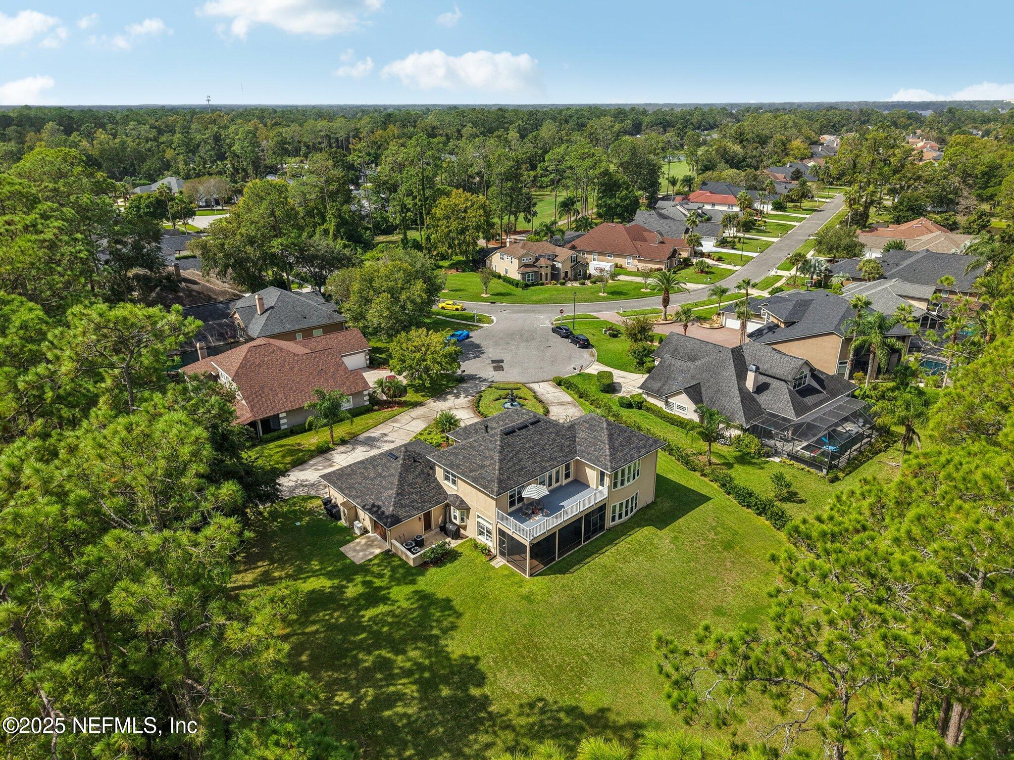 2300 Spring Hill Court Fleming Island, FL 32003 - Photo 35 of 45 an aerial view of residential houses with outdoor space and trees all around
