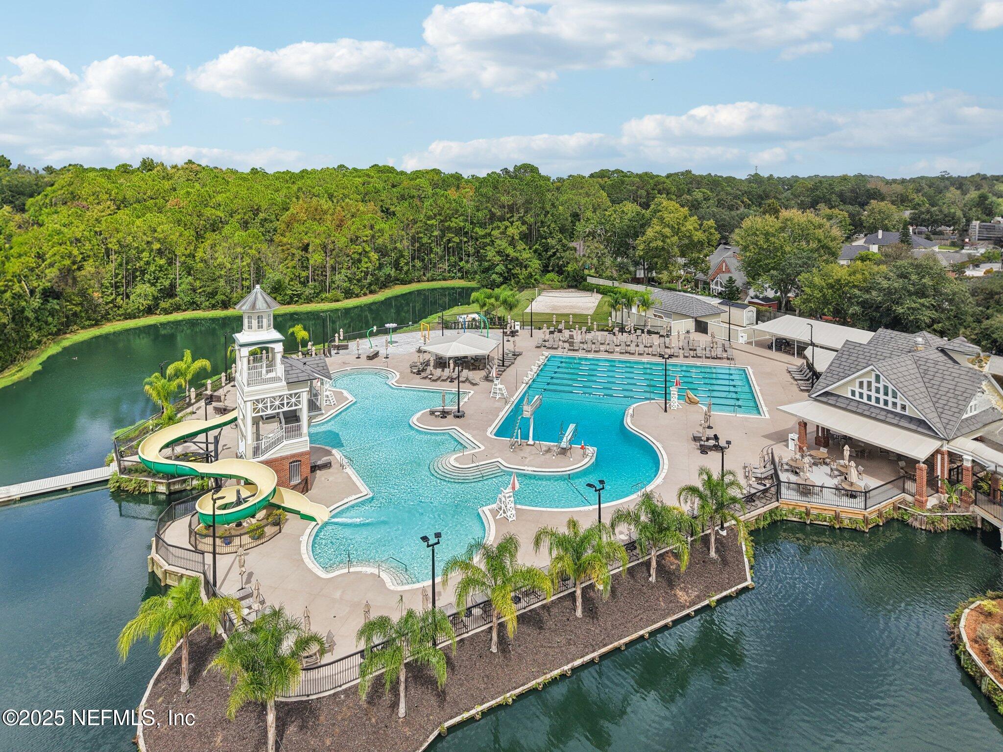 2300 Spring Hill Court Fleming Island, FL 32003 - Photo 38 of 45 a view of a lake with couches swimming pool and lake view
