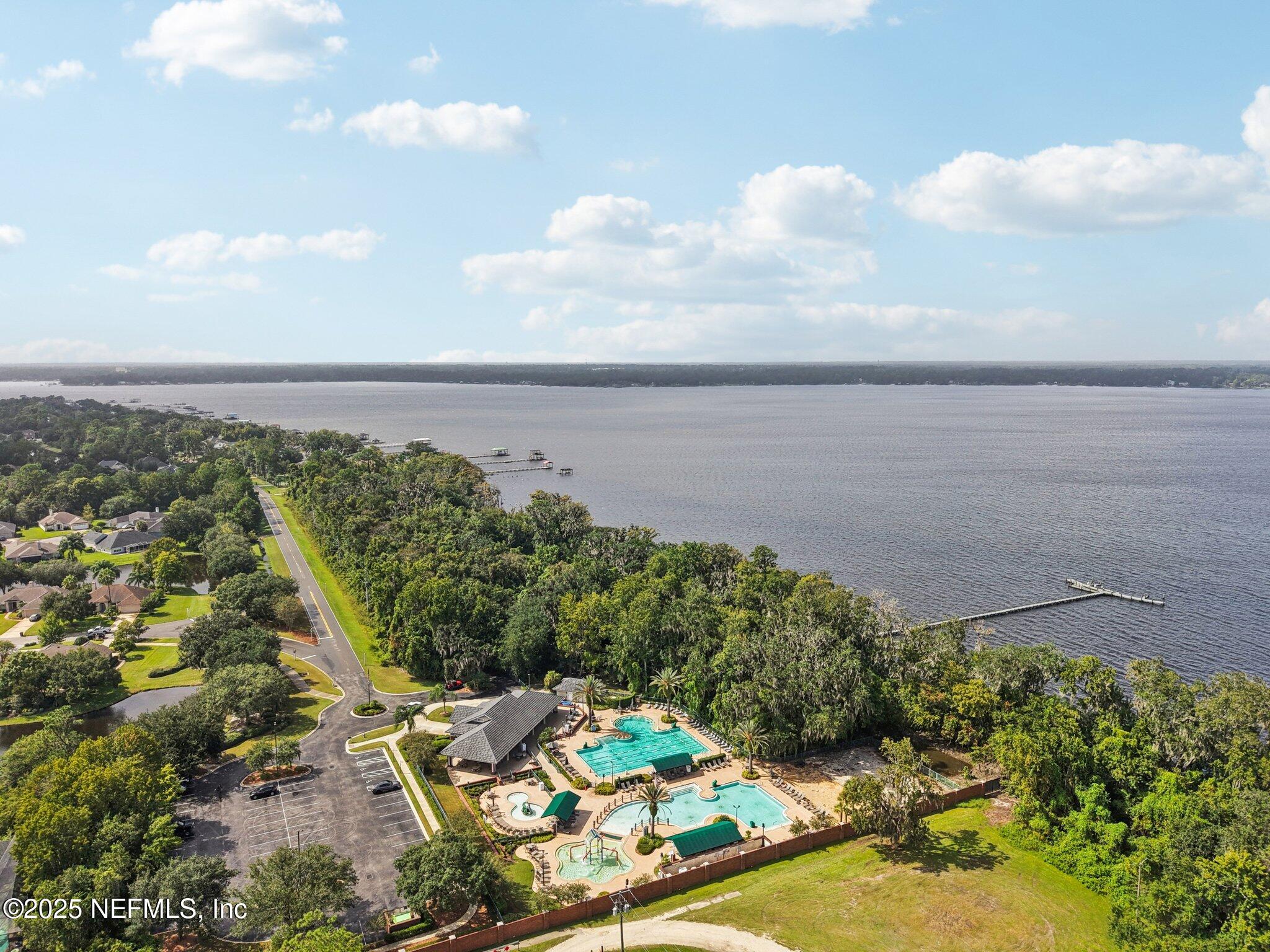 2300 Spring Hill Court Fleming Island, FL 32003 - Photo 44 of 45 a view of a lake with lawn chairs