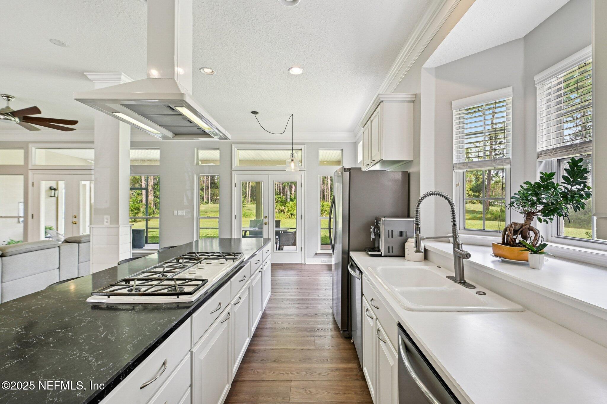 2300 Spring Hill Court Fleming Island, FL 32003 - Photo 6 of 45 a large kitchen with stainless steel appliances granite countertop a lot of counter space and a sink