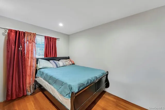 a kitchen with stainless steel appliances granite countertop a refrigerator and a wooden floors