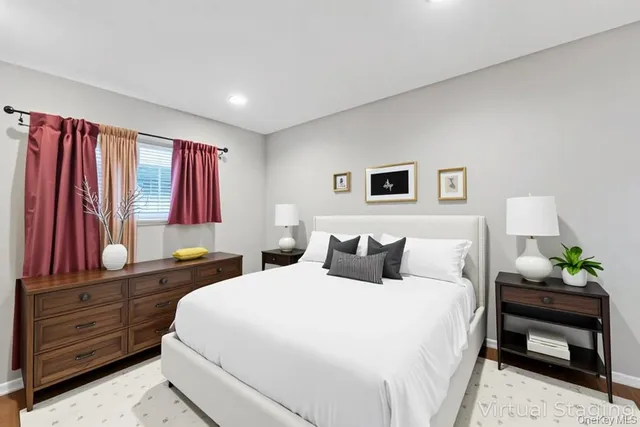 a kitchen with granite countertop a stove and a wooden floors