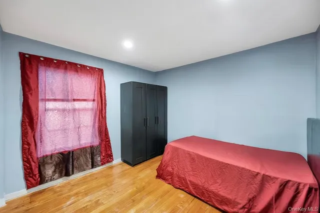 a view of a room with furniture and wooden floor