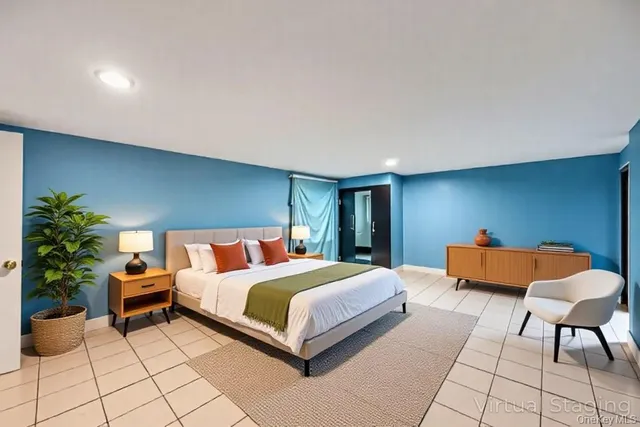 a bedroom with a bed and a dresser