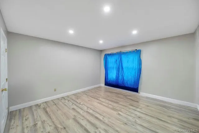 a bedroom with furniture and a chair