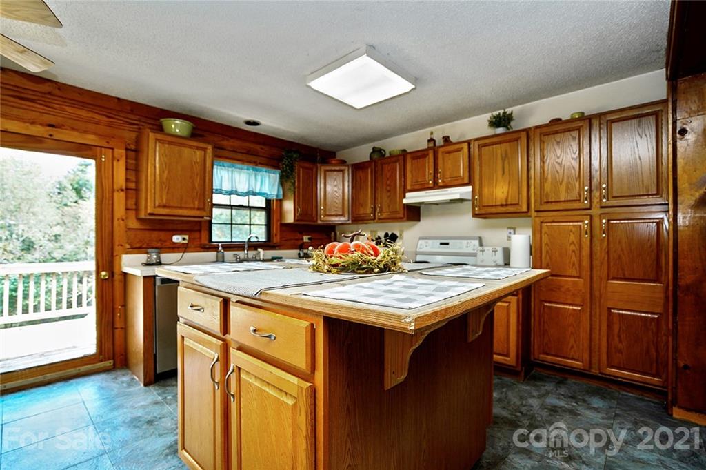 1453 Barger Road Salisbury, NC 28146 - Photo 11 of 41 a kitchen with a stove a refrigerator and a sink