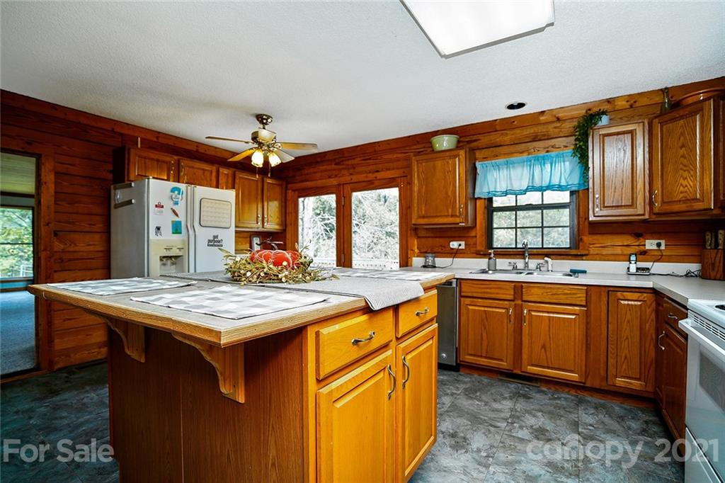 1453 Barger Road Salisbury, NC 28146 - Photo 12 of 41 a kitchen with stainless steel appliances granite countertop a stove a sink dishwasher and a refrigerator