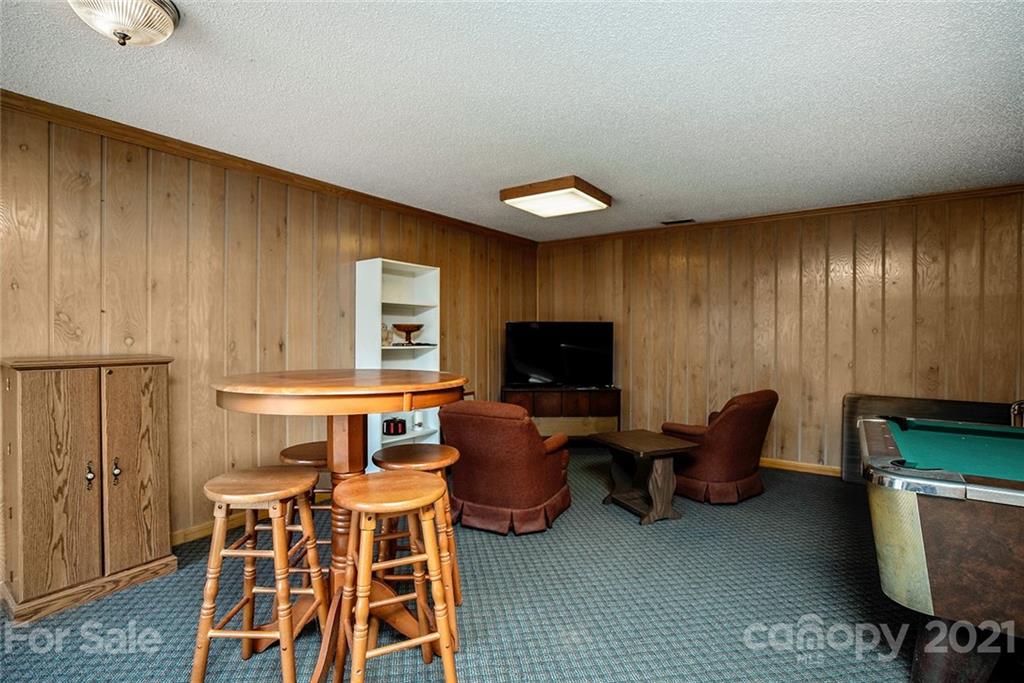1453 Barger Road Salisbury, NC 28146 - Photo 23 of 41 a living room with furniture a flat screen tv and a window