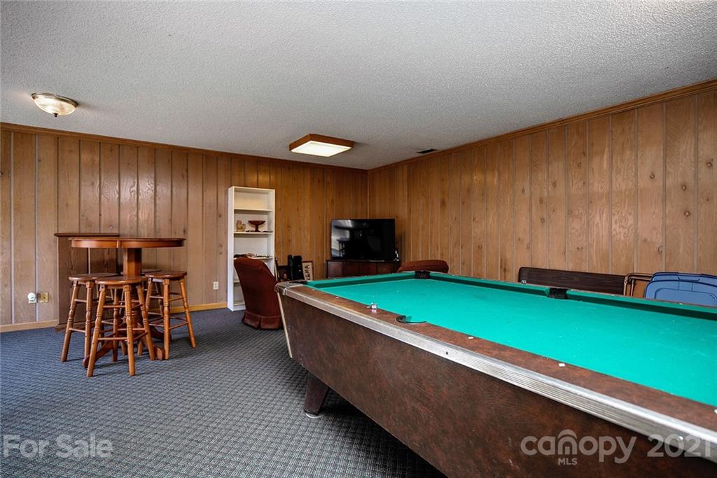 1453 Barger Road Salisbury, NC 28146 - Photo 24 of 41 a room with furniture and a flat screen tv