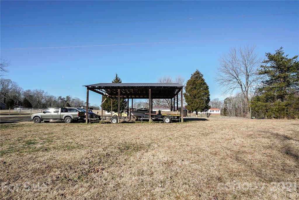 1453 Barger Road Salisbury, NC 28146 - Photo 32 of 41 a view of a house with backyard and sitting area