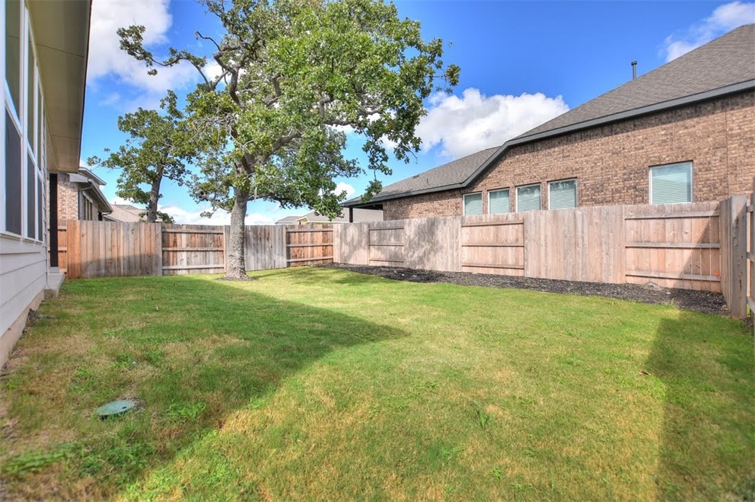 704 Bonnet Boulevard Georgetown, TX 78628 - Photo 30 of 40 Low maintenance yard with a big oak tree