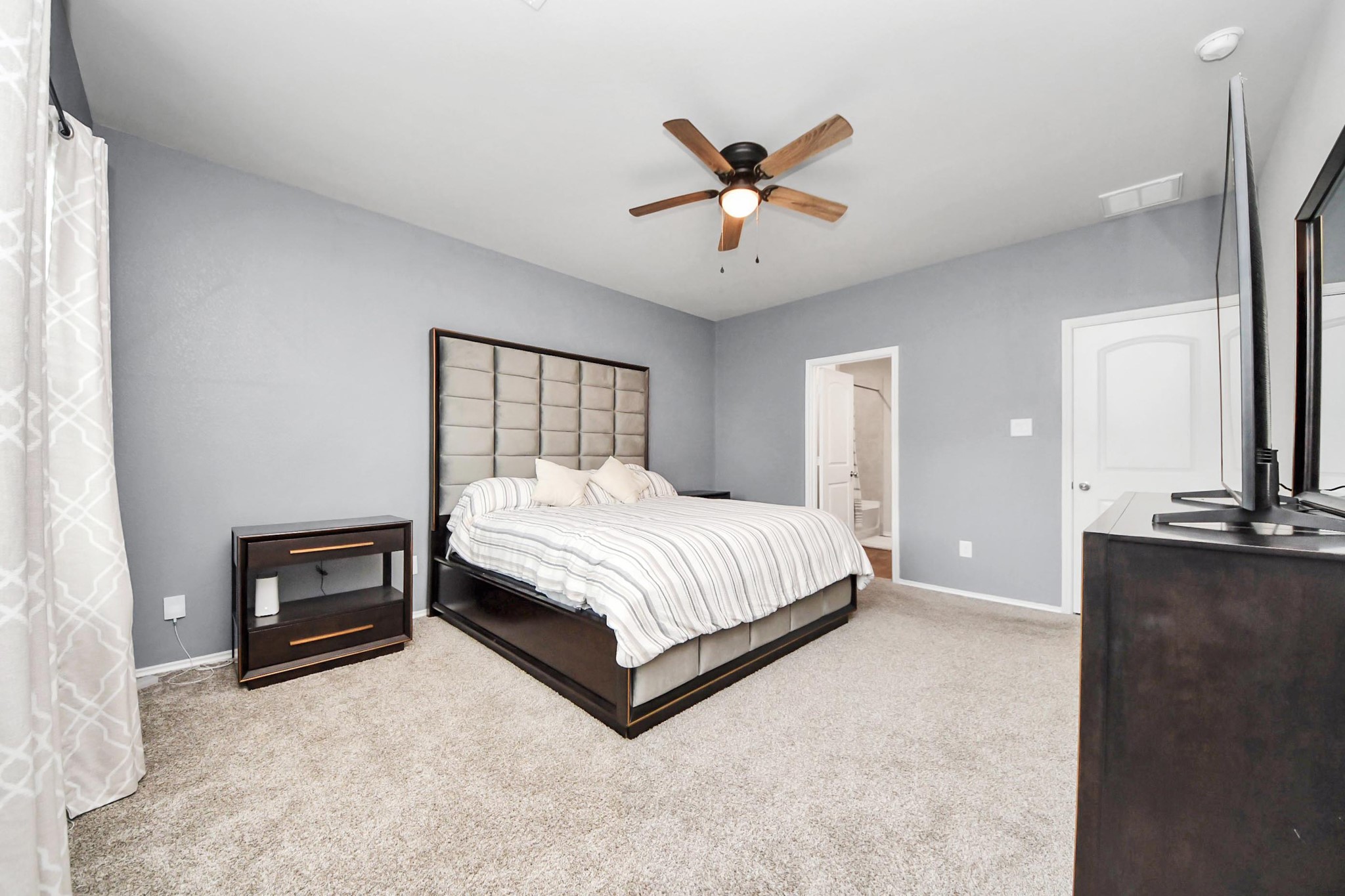 2347 Pettingell Way Spring Spring, TX 77373 - Photo 28 of 41 Alternate view of primary bedroom highlighting generous layout and cozy ambiance.