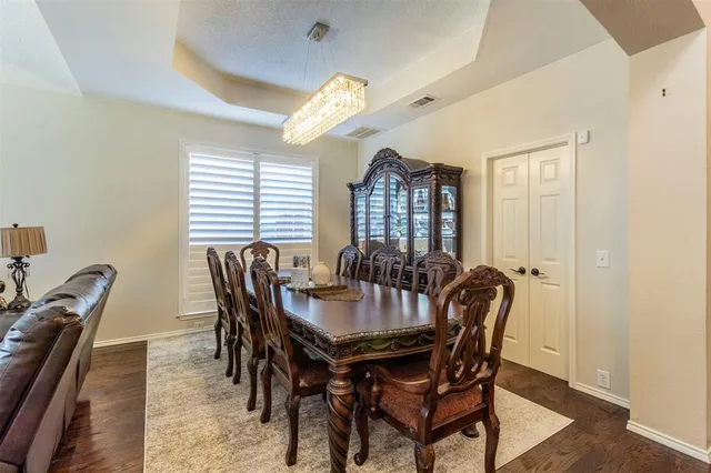 a view of a dining room with furniture and window