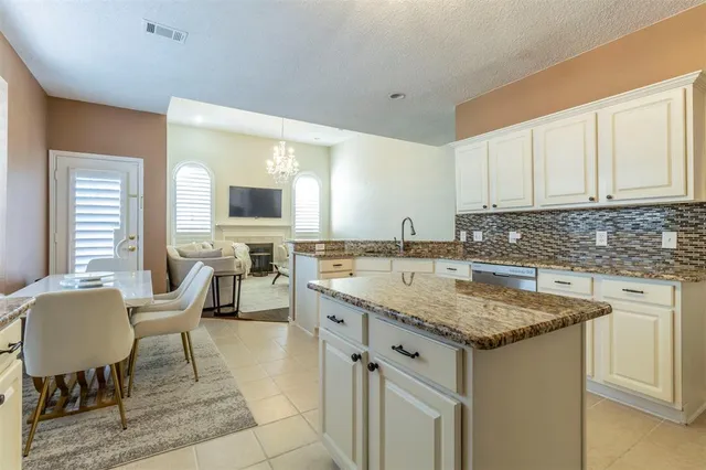 a view of living room with granite countertop furniture and fireplace