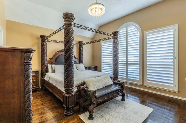 a bed room with a bed and a window