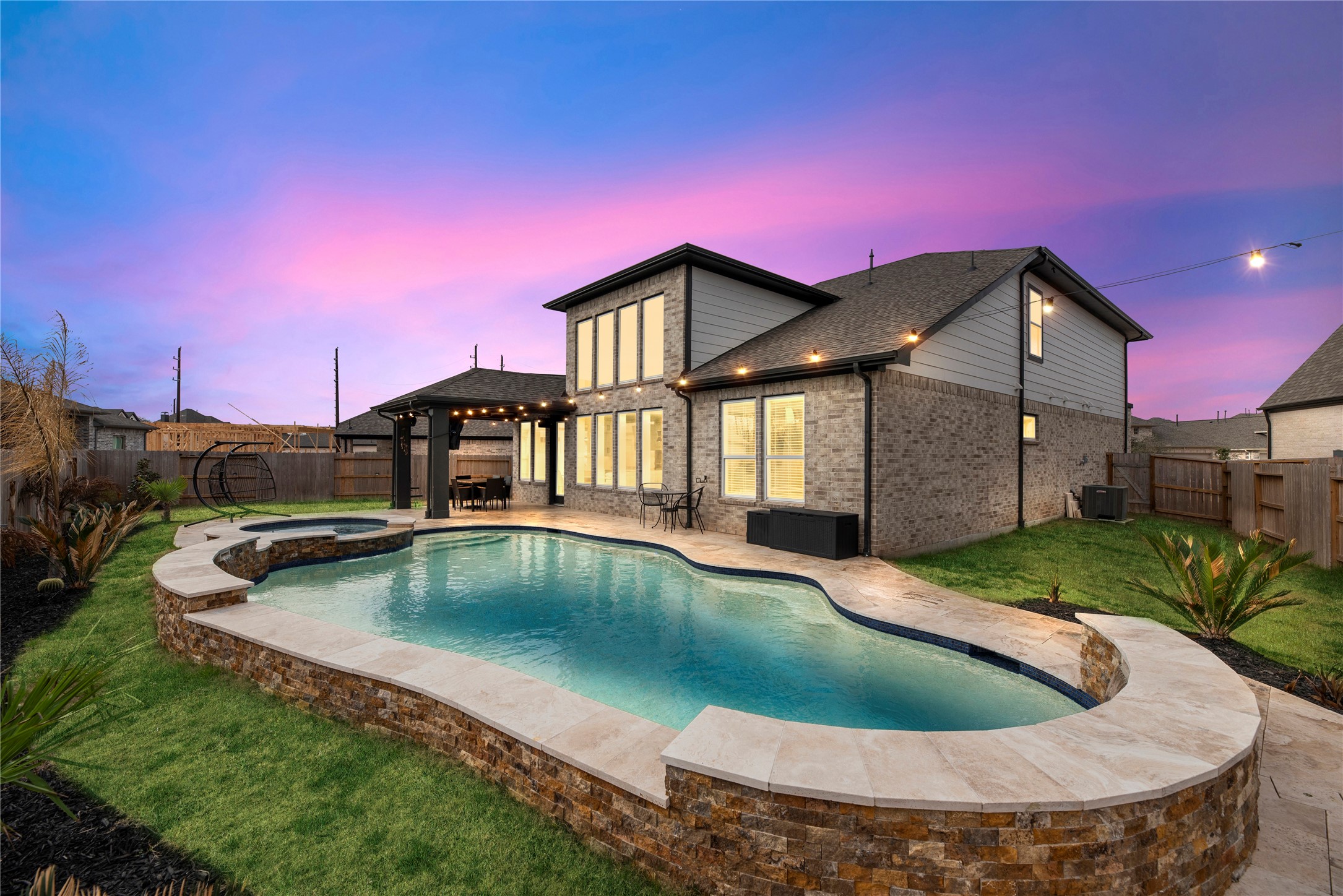30155 GOLD FINCH Place Fulshear, TX 77441 - Photo 2 of 26 Teaser alert- Splash, sizzle, unwind and entertain in your private oasis in your heated pool and spa. Paradise found!