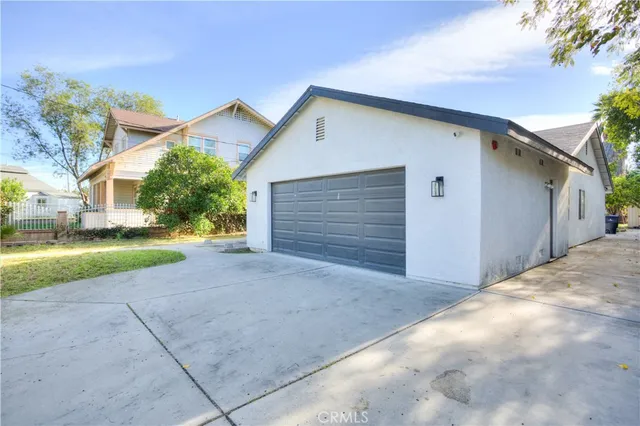 a view of a house with a yard and garage