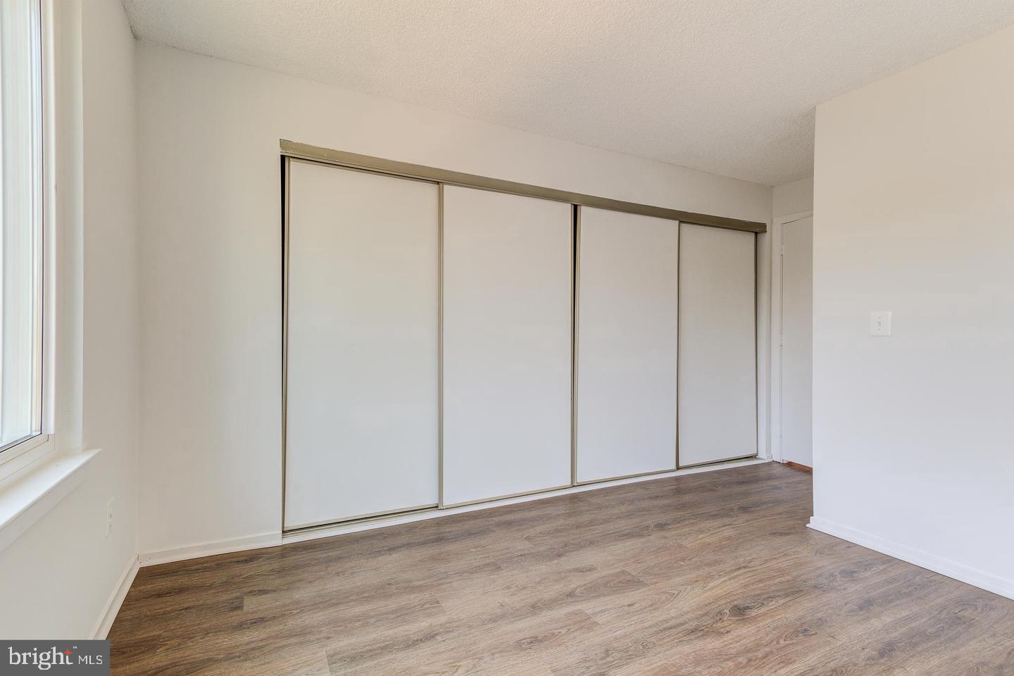 11707 D Summerchase Circle Reston, VA 20194 - Photo 11 of 21 a view of an empty room with wooden floor
