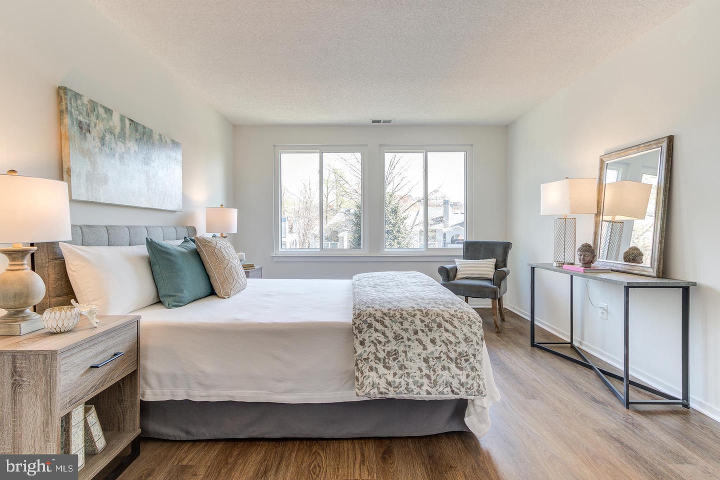 11707 D Summerchase Circle Reston, VA 20194 - Photo 14 of 21 a bedroom with a large bed and a large window