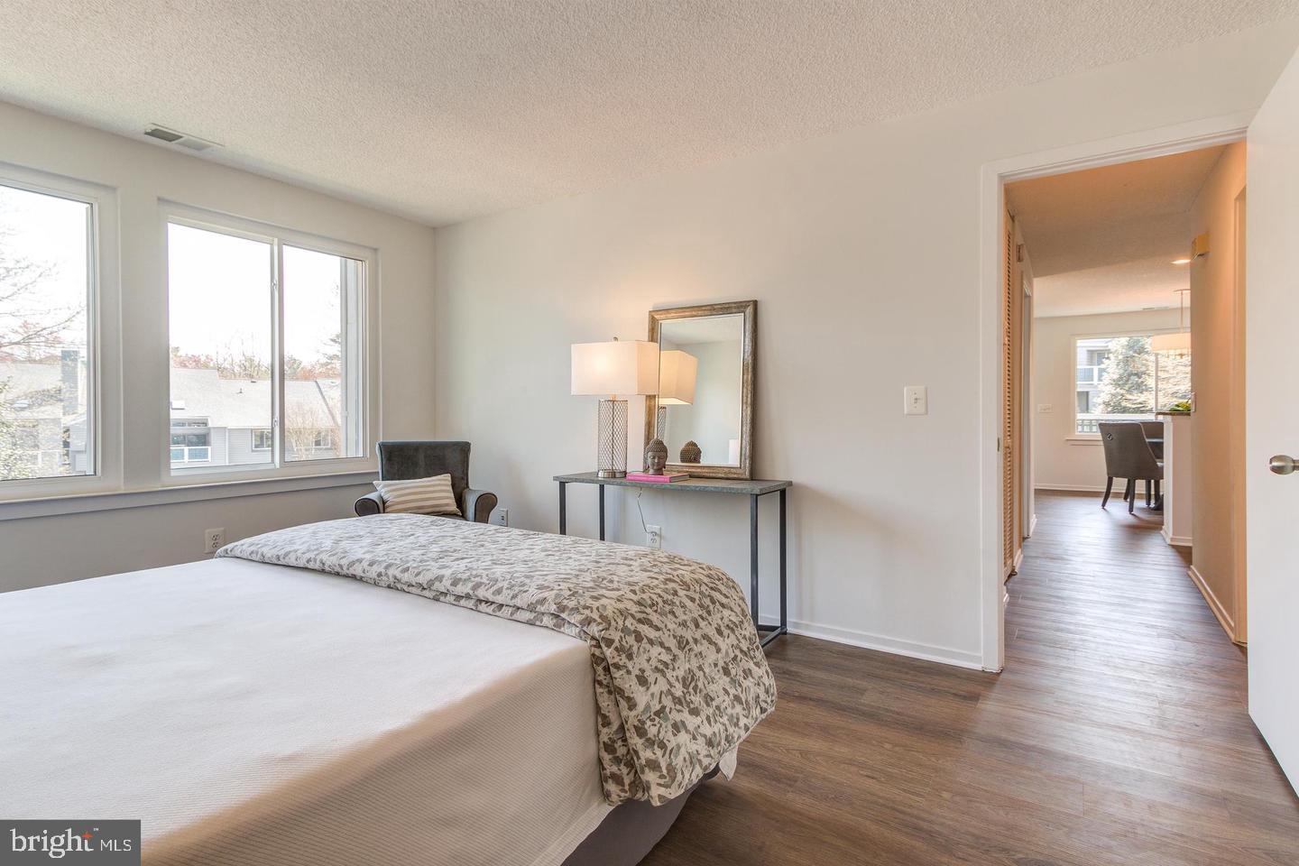 11707 D Summerchase Circle Reston, VA 20194 - Photo 15 of 21 a bedroom with a bed and a large window