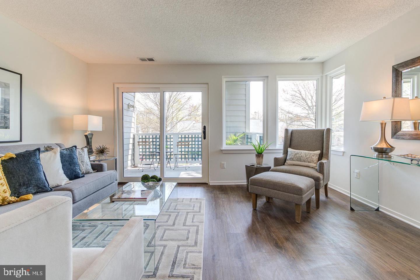 11707 D Summerchase Circle Reston, VA 20194 - Photo 2 of 21 a living room with furniture and a large window