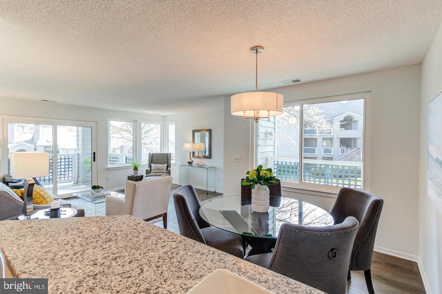 11707 D Summerchase Circle Reston, VA 20194 - Photo 5 of 21 a view of a dining room with furniture window and outside view