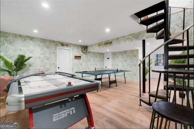 a view of a patio with table and chairs