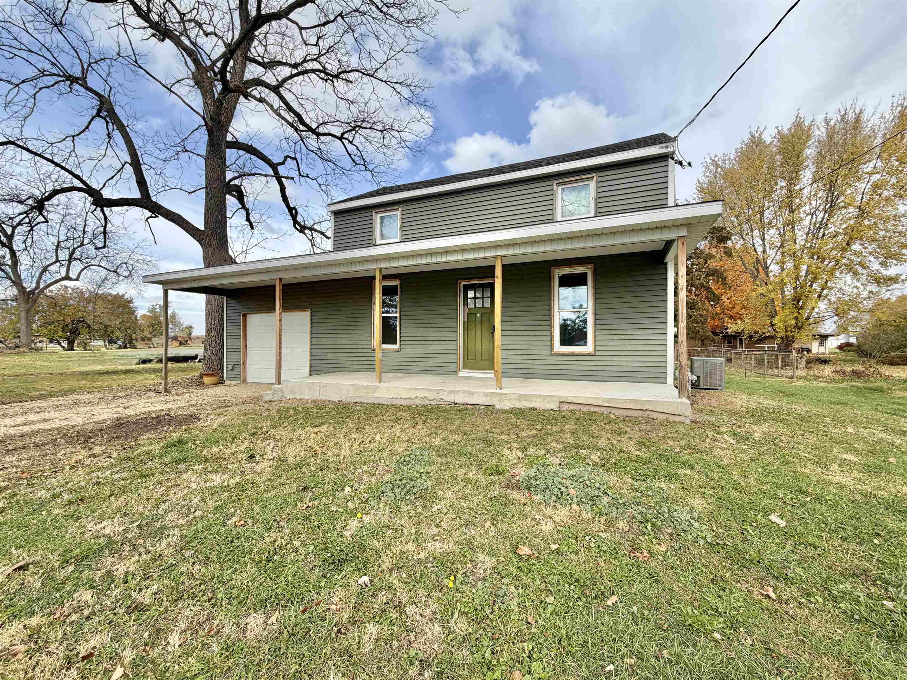 423 West 4th Street Byron, IL 61010 - Photo 30 of 31 a front view of a house with a garden