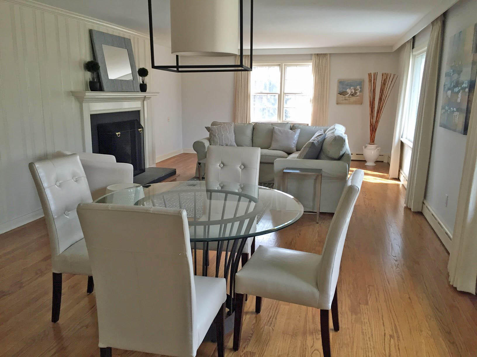 8 Little Brook Road Rowayton, CT 06853 - Photo 8 of 20 a view of a dining room with furniture window and wooden floor