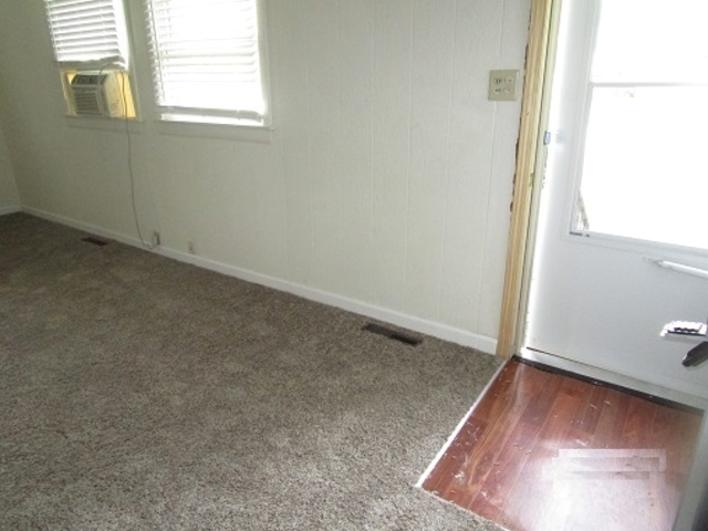 101 Prairie Street Ottawa, IL 61350 - Photo 2 of 15 an empty room with windows