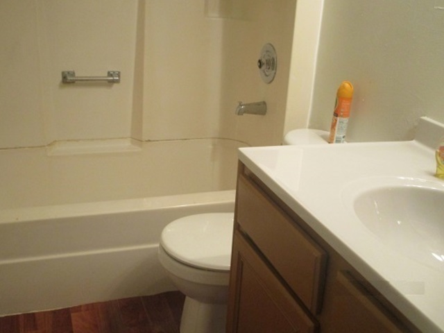 101 Prairie Street Ottawa, IL 61350 - Photo 10 of 15 a bathroom with a sink a toilet and shower
