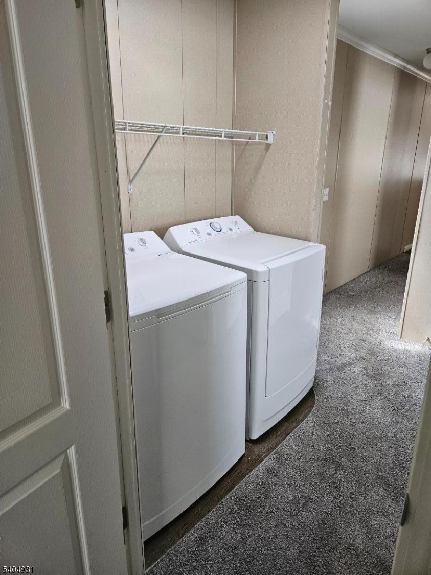 44 Ridge Road, Unit 13 Oak Ridge, NJ 07438 - Photo 13 of 17 a utility room with dryer and washer