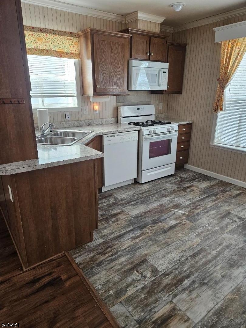 44 Ridge Road, Unit 13 Oak Ridge, NJ 07438 - Photo 15 of 17 a kitchen with stainless steel appliances granite countertop a stove a sink and a microwave