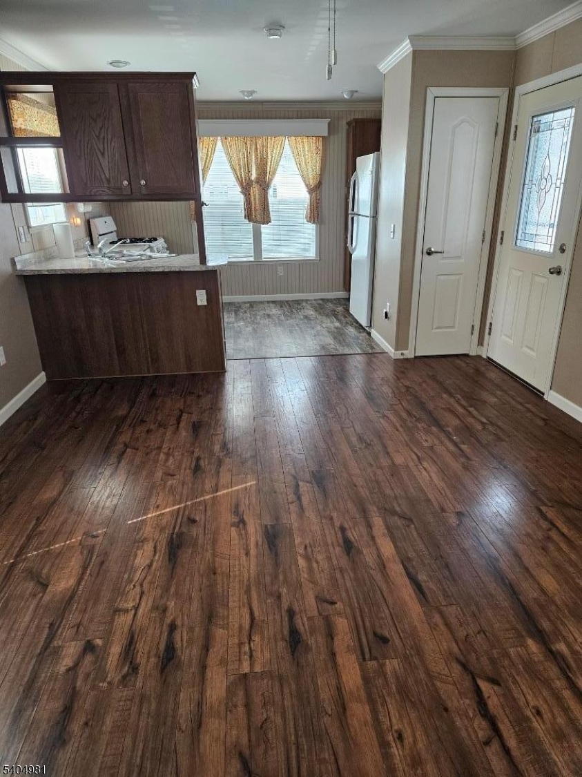 44 Ridge Road, Unit 13 Oak Ridge, NJ 07438 - Photo 16 of 17 an empty room with wooden floor and windows